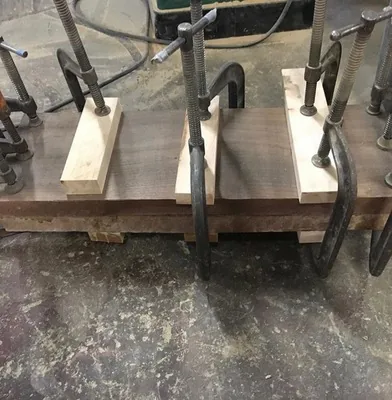Chair legs glued and clamped in the workshop, New York, NY, by NYC Reupholstery