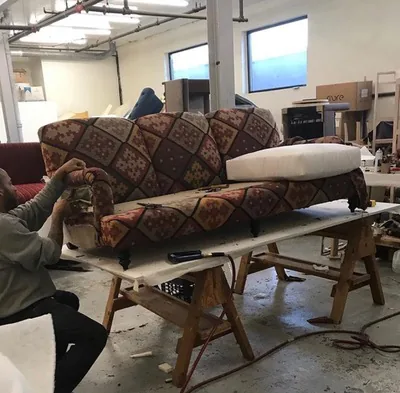 Sofa stripped and being reupholstered in the workshop, New York, NY, by NYC Reupholstery